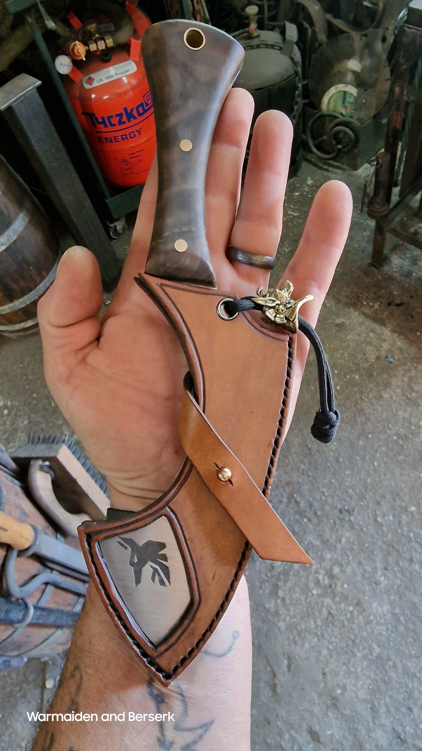 Hand-forged small knife in Chepesh form made of carbon steel with robust leather sheath