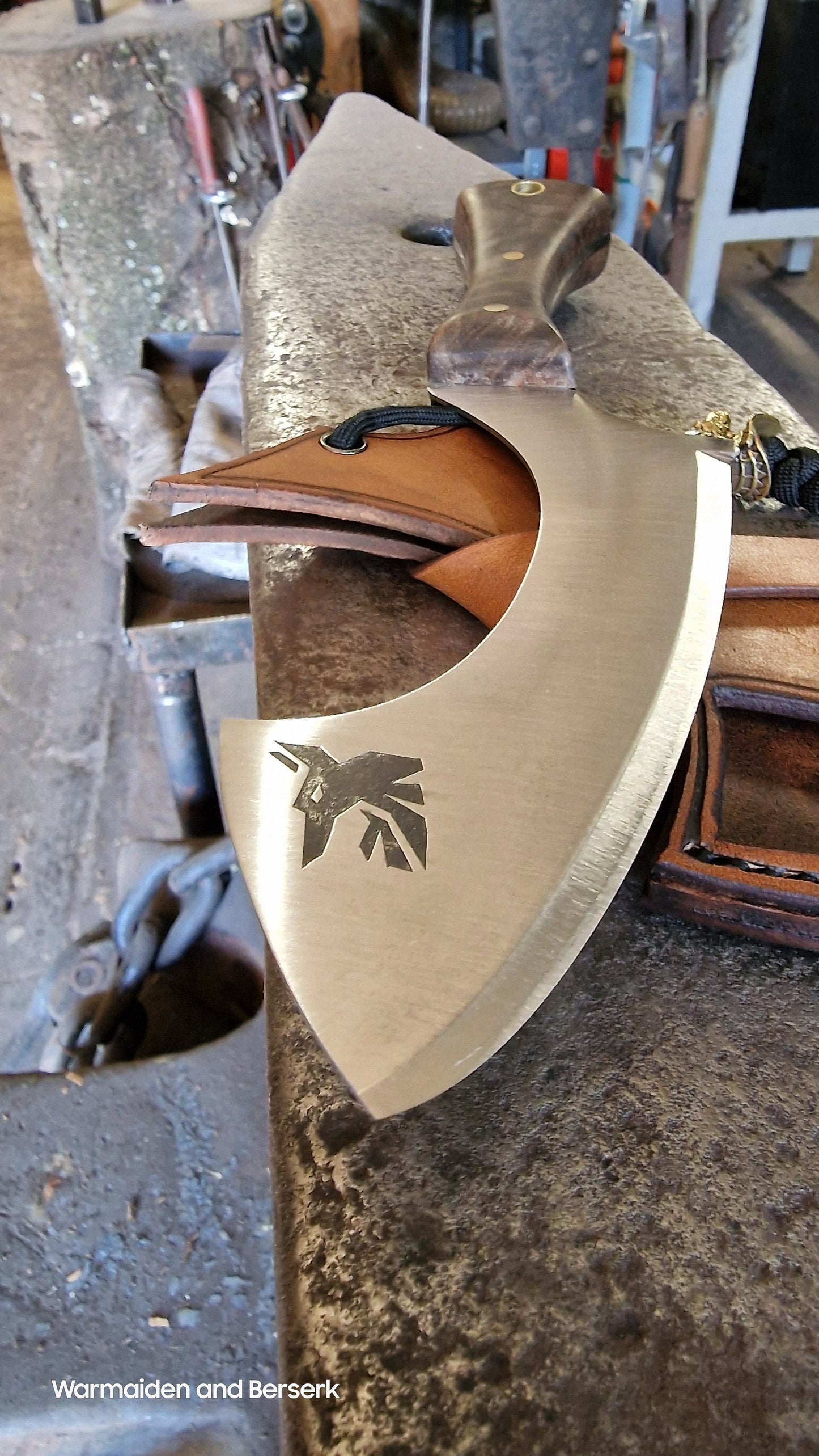 Hand-forged small knife in Chepesh form made of carbon steel with robust leather sheath